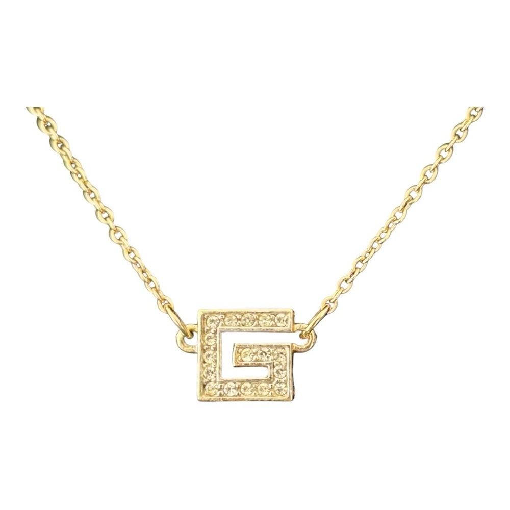 GIVENCHY “G” Gold Pendant with Rhinestones.